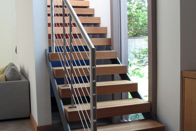 Small minimalist wooden straight open staircase photo in Dallas