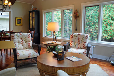 Living room - large traditional open concept medium tone wood floor living room idea in Milwaukee with beige walls