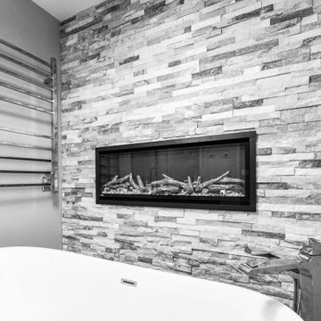 Striking Master Ensuite Featuring a Built-In Electric Fireplace