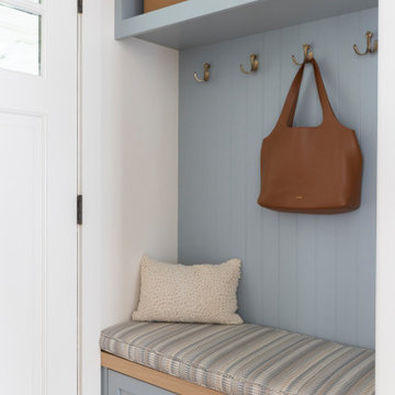 Light Blue Entryway Built In Bench with Custom Cushion and Brass Hooks