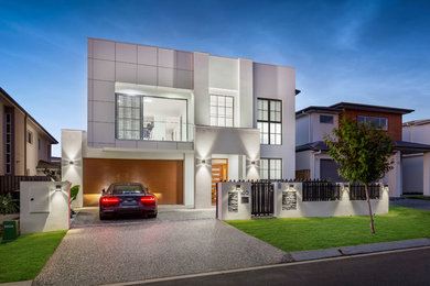 Design ideas for a large contemporary two-storey white house exterior in Brisbane.