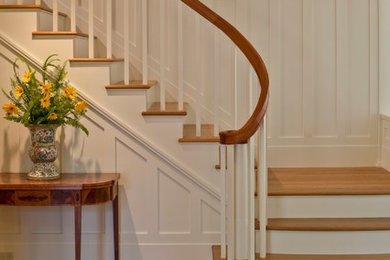 Mid-sized elegant wooden l-shaped staircase photo in Other with painted risers