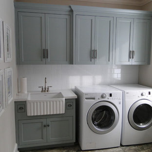 Medium sized traditional single-wall separated utility room in Toronto with a belfast sink, engineered stone countertops, grey walls, marble flooring, a side by side washer and dryer, shaker cabinets and grey cabinets.