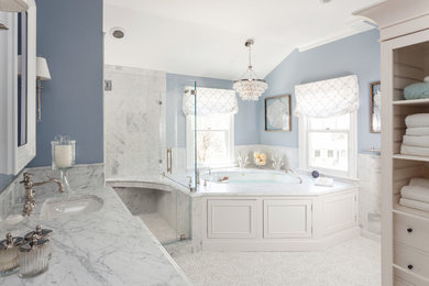 Example of a large classic master white tile and stone tile mosaic tile floor corner shower design in Boston with an undermount sink, beaded inset cabinets, white cabinets, marble countertops, an undermount tub and blue walls