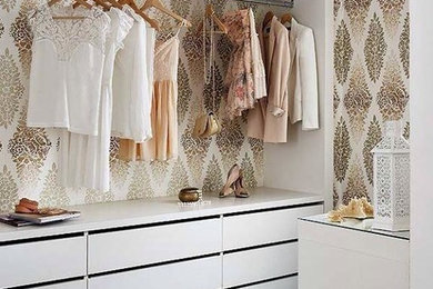 Mid-sized cottage chic women's dark wood floor and brown floor walk-in closet photo in Vancouver with open cabinets and white cabinets