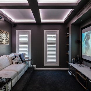 Inspiration for a small modern enclosed home cinema in Sydney with grey walls and a projector screen.