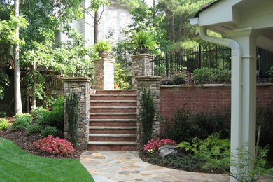 Inspiration for a mid-sized traditional full sun backyard stone water fountain landscape in Atlanta for spring.
