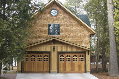 Example of a large brown two-story brick exterior home design in Other