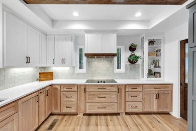Example of a large cottage u-shaped vinyl floor and tray ceiling eat-in kitchen design in Atlanta with shaker cabinets, light wood cabinets, quartzite countertops, white backsplash, ceramic backsplash and white countertops