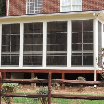 Custom EzeBreeze porch with flat EPDM rubber roof.