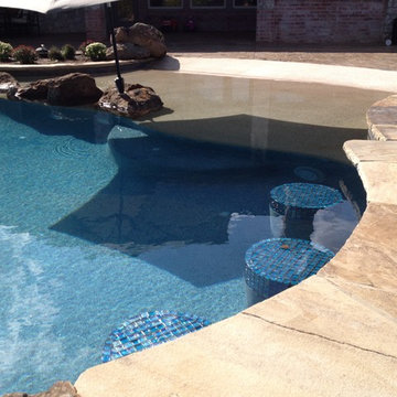 Beach Entry next to swim up bar boulders in pool