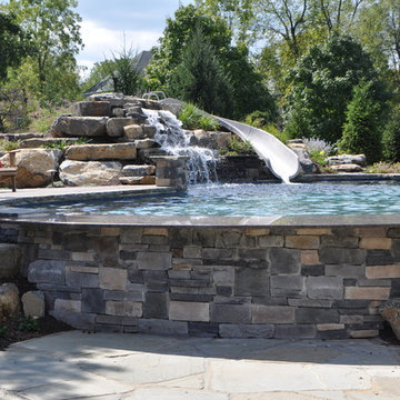 Upper saucon pool with waterslide and swim up bar
