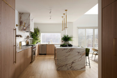 Inspiration for a mid-sized contemporary l-shaped light wood floor and beige floor eat-in kitchen remodel in Toronto with flat-panel cabinets, an island, an undermount sink, light wood cabinets, multicolored backsplash, stone slab backsplash, stainless steel appliances and multicolored countertops