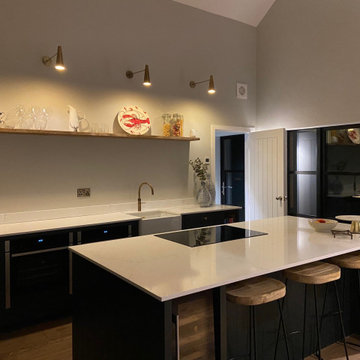 Large handmade kitchen with kitchen island and full length larder