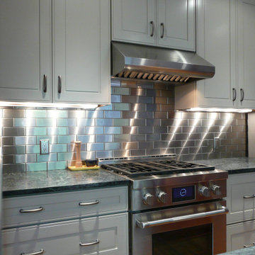 White Kitchens with Stainless Steel Backsplash