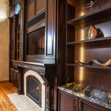 Dark Stained Cherry Cabinetry Surrounds Flush Hearth Stone Tile Fireplace