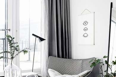 Inspiration for a scandinavian dark wood floor living room remodel in Other with white walls