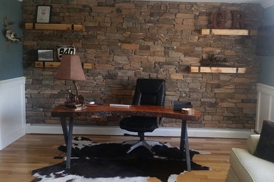 Example of a mountain style freestanding desk light wood floor home office design in Philadelphia with blue walls