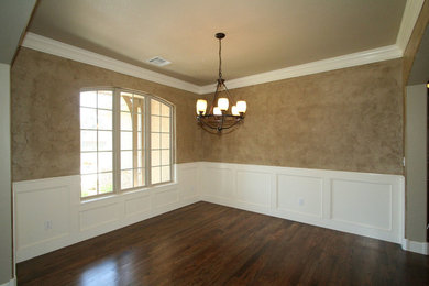 Example of a large dark wood floor kitchen/dining room combo design in Other with brown walls