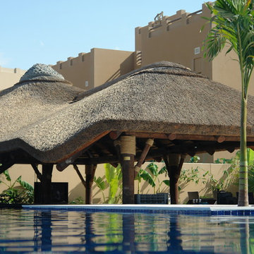 Thatch & timber is the is the focal point of this beautifully landscaped garden