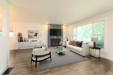 Living room - mid-sized contemporary open concept laminate floor and gray floor living room idea in Toronto with white walls, a tile fireplace, a wall-mounted tv and a standard fireplace