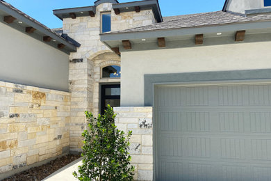 Inspiration for a large farmhouse exterior home remodel in Austin