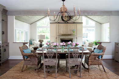 Kitchen/dining room combo - traditional dark wood floor kitchen/dining room combo idea in DC Metro with beige walls and a standard fireplace