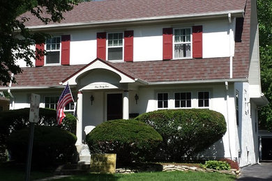 Large french country white two-story stucco exterior home idea in Chicago with a gambrel roof and a shingle roof