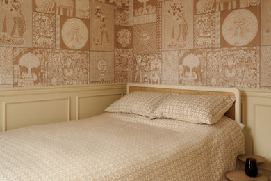 Bedroom - small transitional guest carpeted, beige floor and wallpaper bedroom idea in New York with beige walls