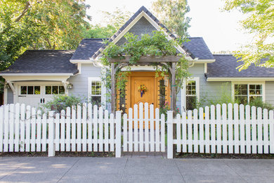 Small cottage chic blue one-story house exterior photo in Other