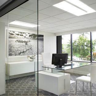 This is an example of a large modern home studio in Miami with white walls, carpet, a freestanding desk and multi-coloured floors.
