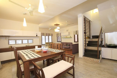Dining room - mid-sized zen marble floor dining room idea in Bengaluru with white walls
