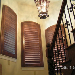 Arch top shutters in stairwell - Interior Shutters