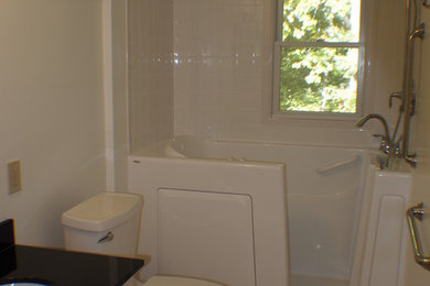 Small elegant ceramic tile ceramic tile bathroom photo in Other with an undermount sink, granite countertops, a two-piece toilet and beige walls