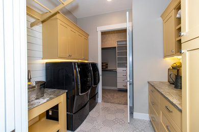 Example of an arts and crafts laundry room design in Other