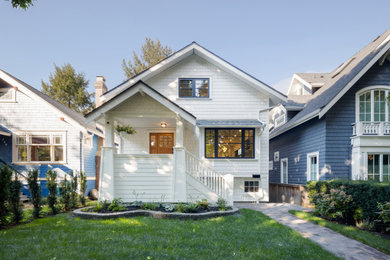 Mid-sized minimalist white two-story house exterior photo in Vancouver with a shingle roof