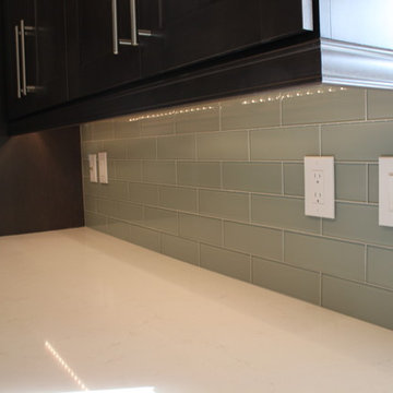 After: New countertop & backsplash with under-cabinet lighting