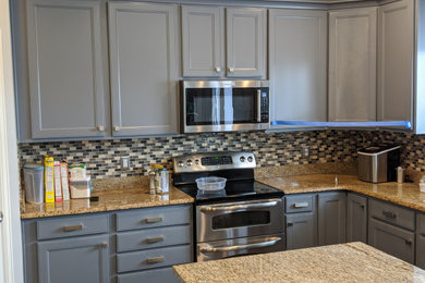 Example of a mid-sized farmhouse eat-in kitchen design in Salt Lake City