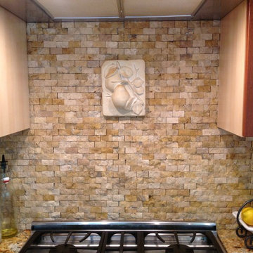 Kitchen backsplash with split face stone