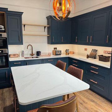 Copper T-Shaped Pull Handles in a Navy Blue Kitchen, USA