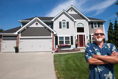 Inspiration for a transitional multicolored house exterior remodel in Omaha