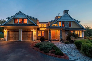 Inspiration for a craftsman yellow mixed siding exterior home remodel in Portland Maine