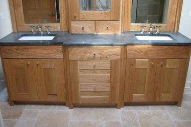 Bathroom - mid-sized transitional master travertine floor bathroom idea in Chicago with shaker cabinets, light wood cabinets, white walls, an undermount sink and soapstone countertops