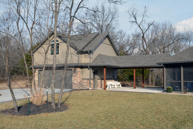 Inspiration for a large timeless split-level house exterior remodel in St Louis