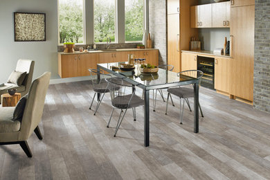 Example of a mid-sized transitional medium tone wood floor open concept kitchen design in Charlotte