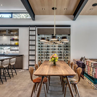 カルガリーの広いコンテンポラリースタイルのLDKの画像 (コンクリートの床、グレーの壁、暖炉なし、グレーの床)