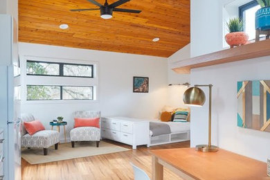 Bedroom - large modern brown floor bedroom idea in Austin with white walls and no fireplace