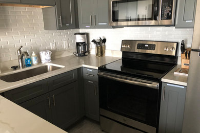 Example of a classic kitchen design in Other with white backsplash and ceramic backsplash