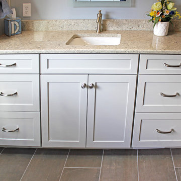 Gray Vanity with Freestanding Tub and Tiled Walkin Shower
