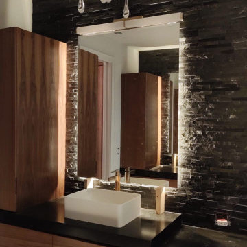 Sleek Modern Bathroom with Backlit Mirror & Vessel Sink